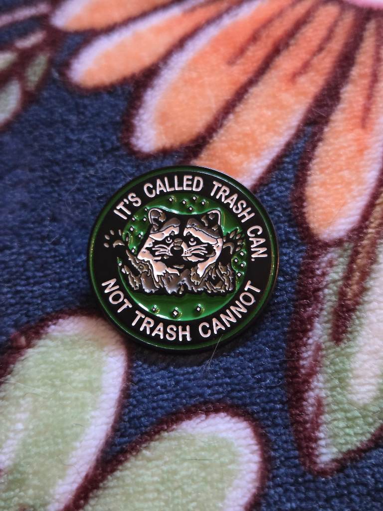 raccoon pin badge