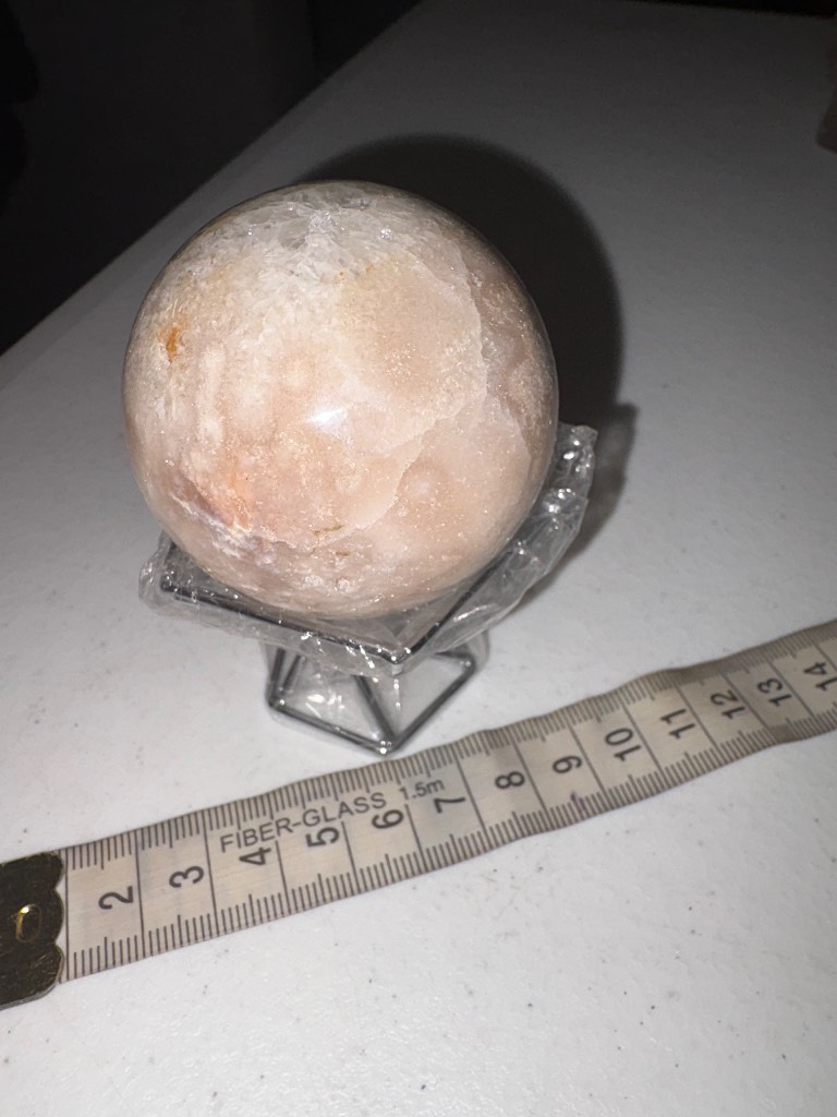 Pink amethyst sphere with silver stand
