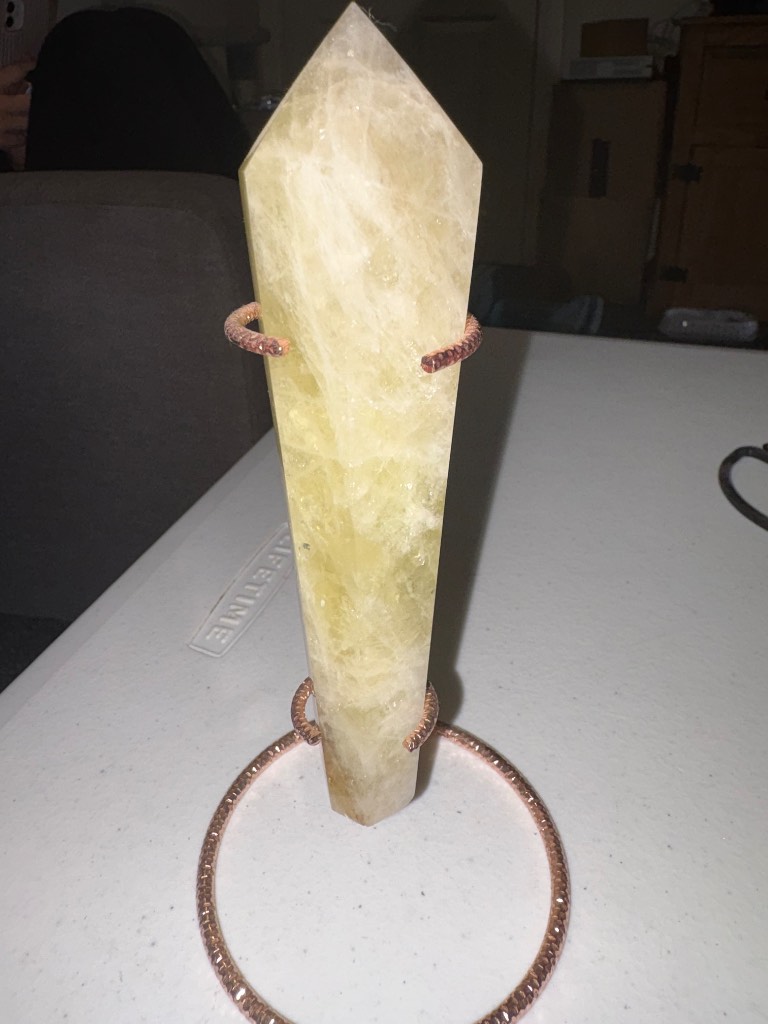 Citrine wand on a rose gold coloured stand