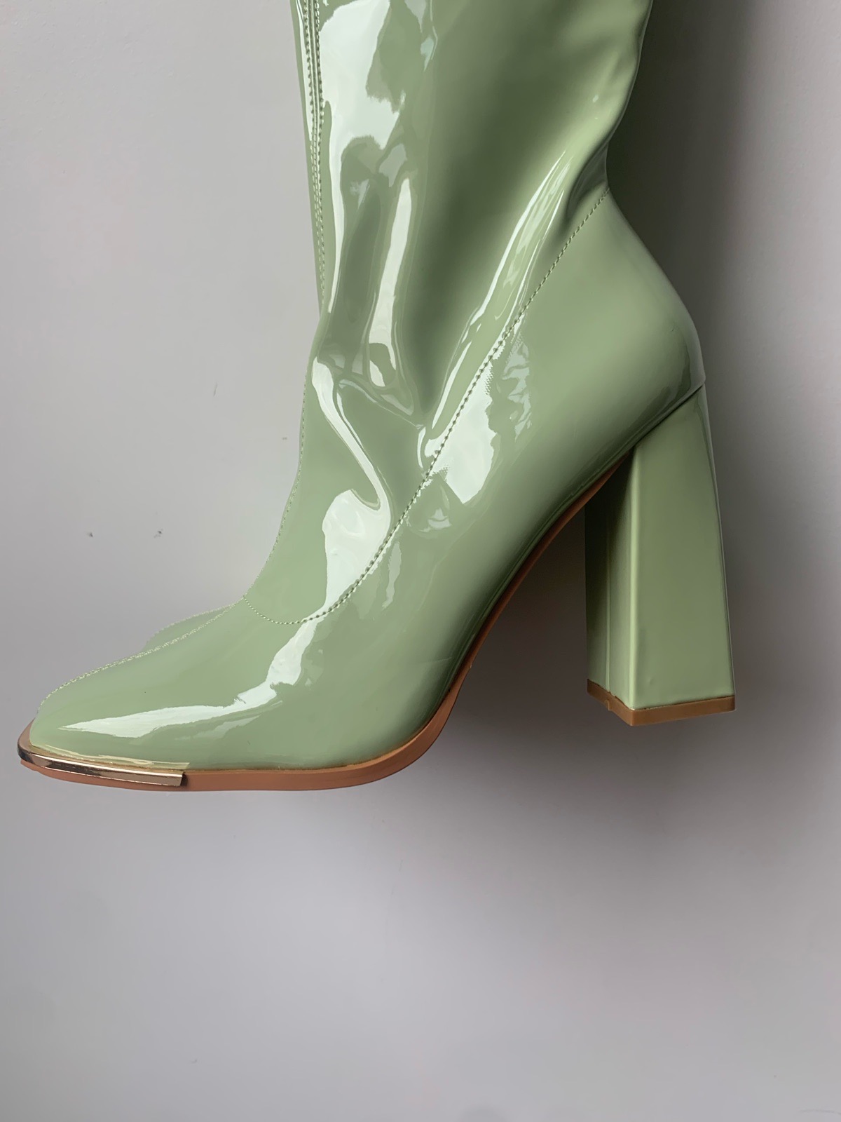 Patent knee high boots