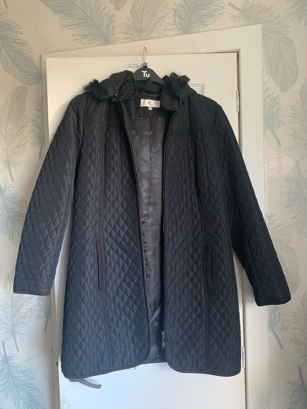 Country Casuals (CC) women's black diamond-quilted coat featuring a hood with faux-fur trim.uk12