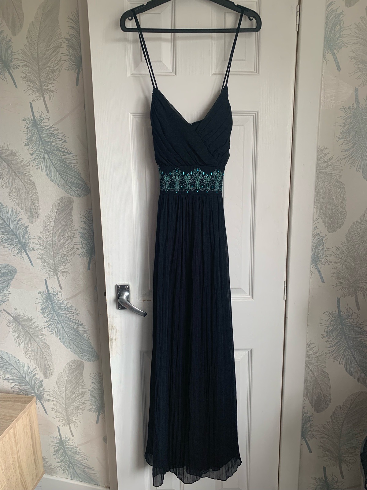 Nicholas Millington black evening dress. delicate straps and ornate teal embroidere waistband.uk 14
