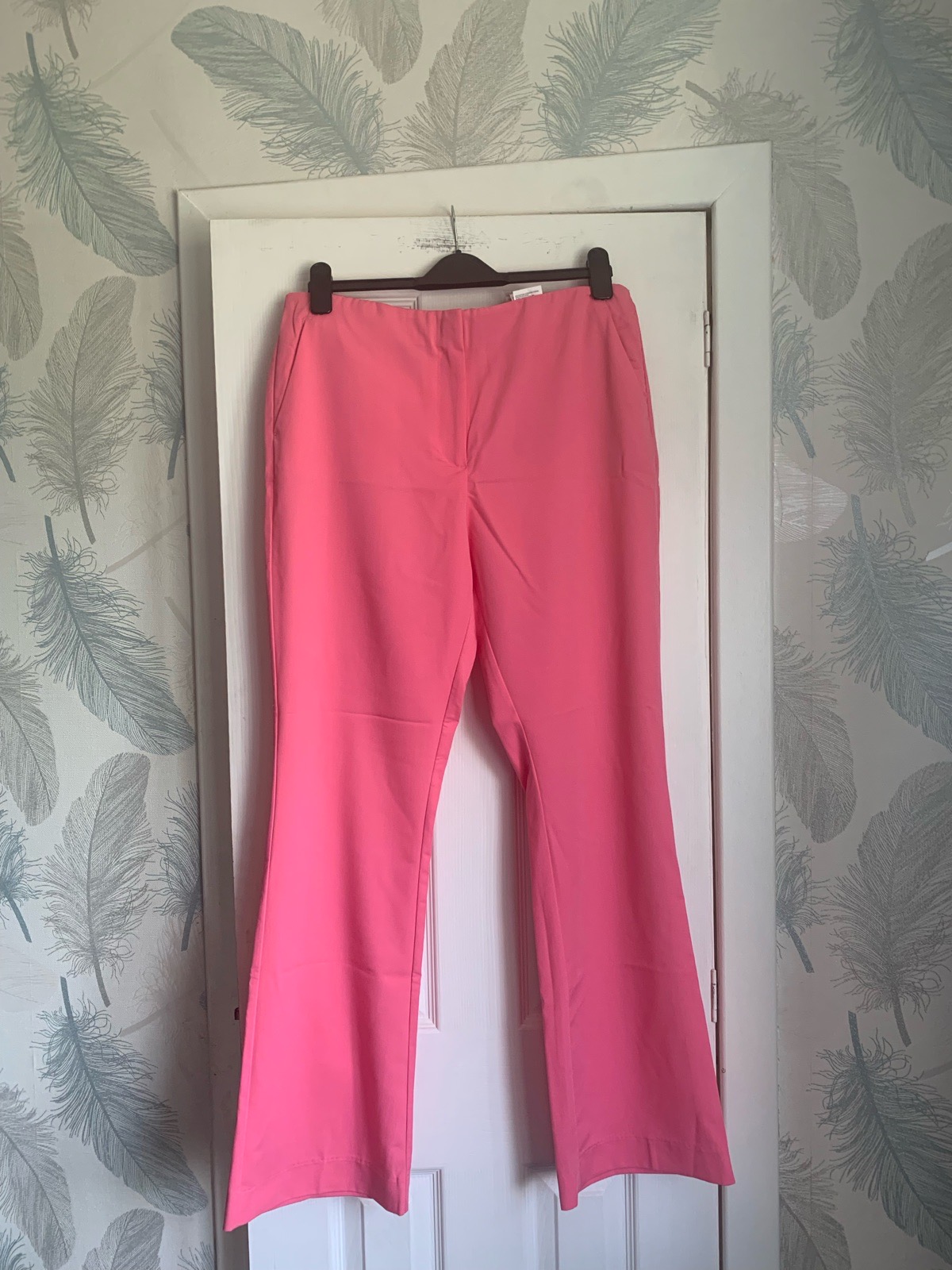 H&M vibrant pink flared trousers feature a structured high-rise waist uk 18