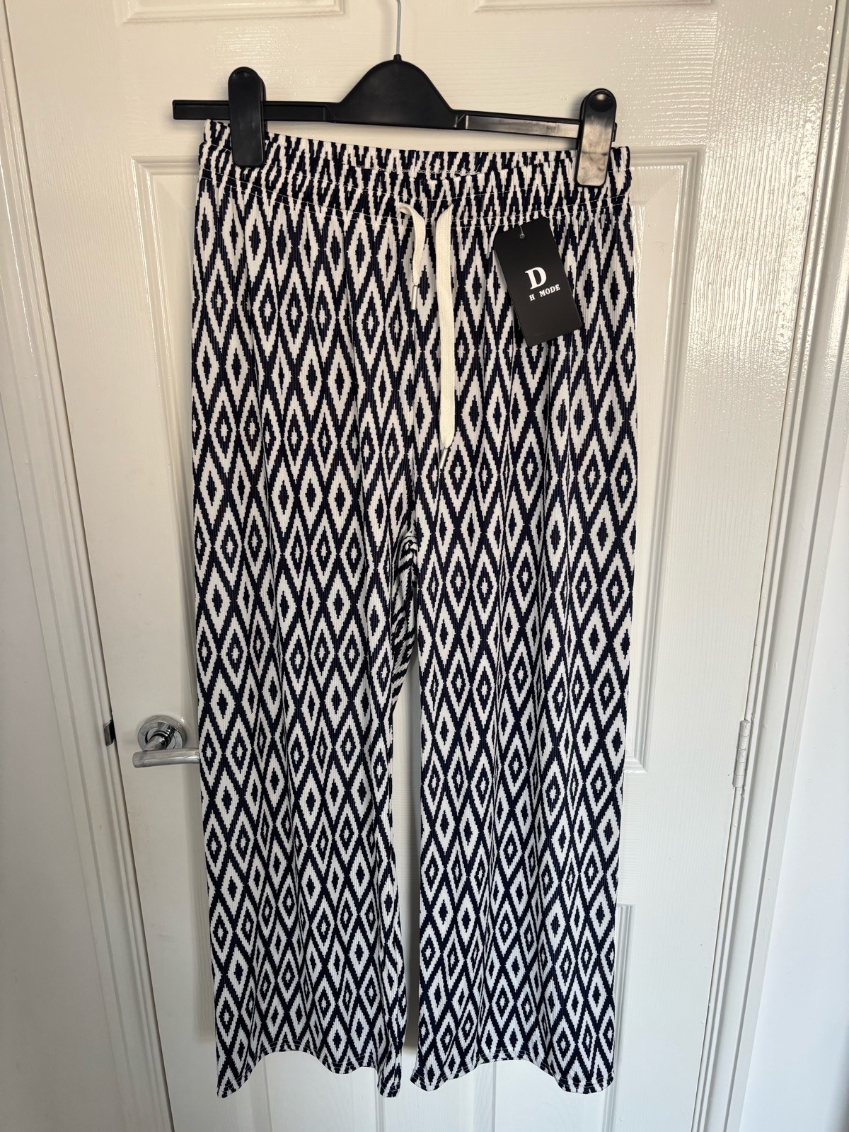 Navy and white patterned wide leg trousers