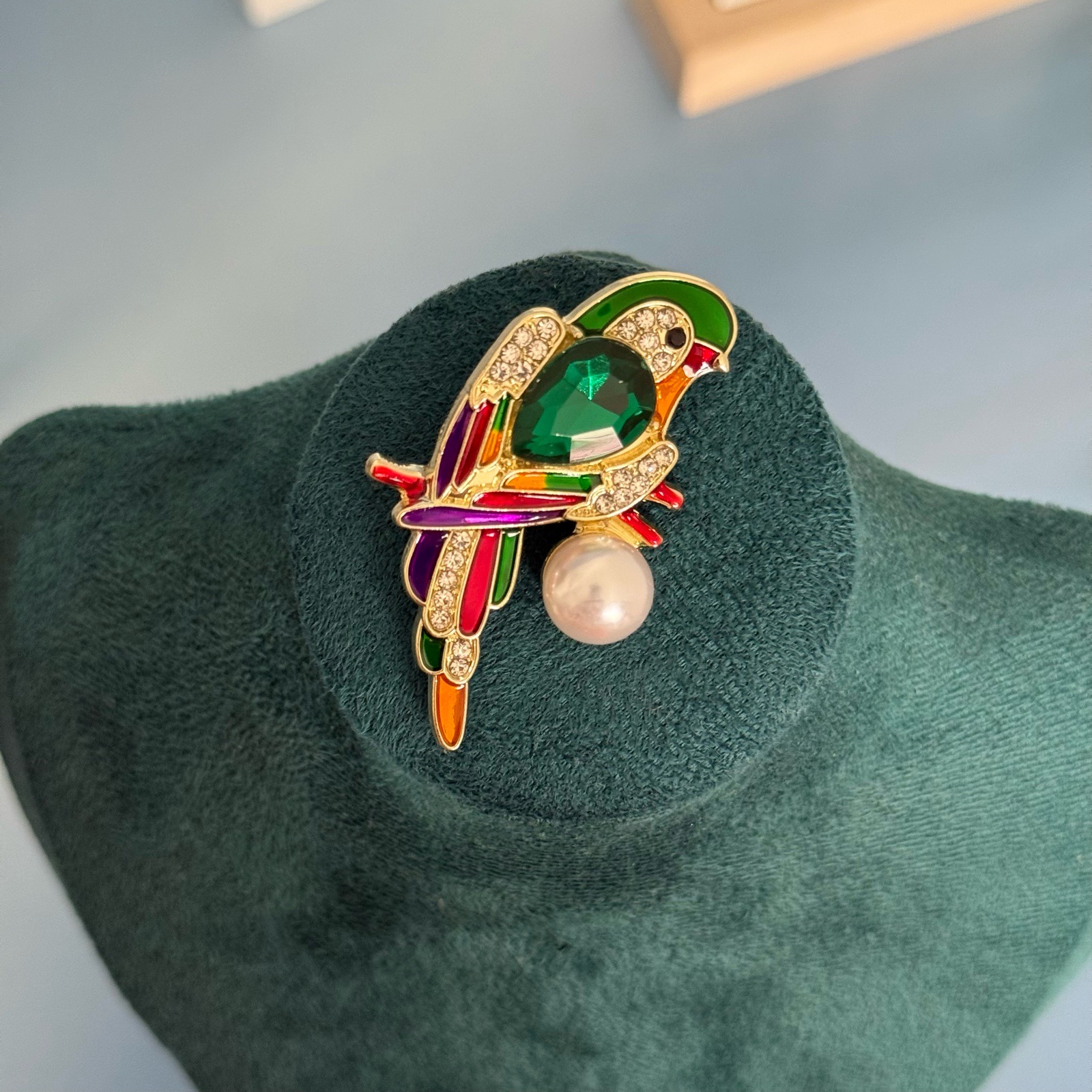 Multicoloured parrot brooch