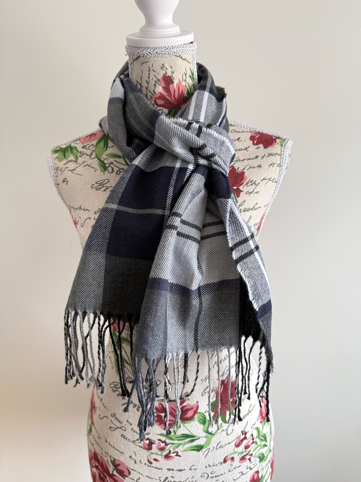 Navy blue and white plaid scarf with fringe