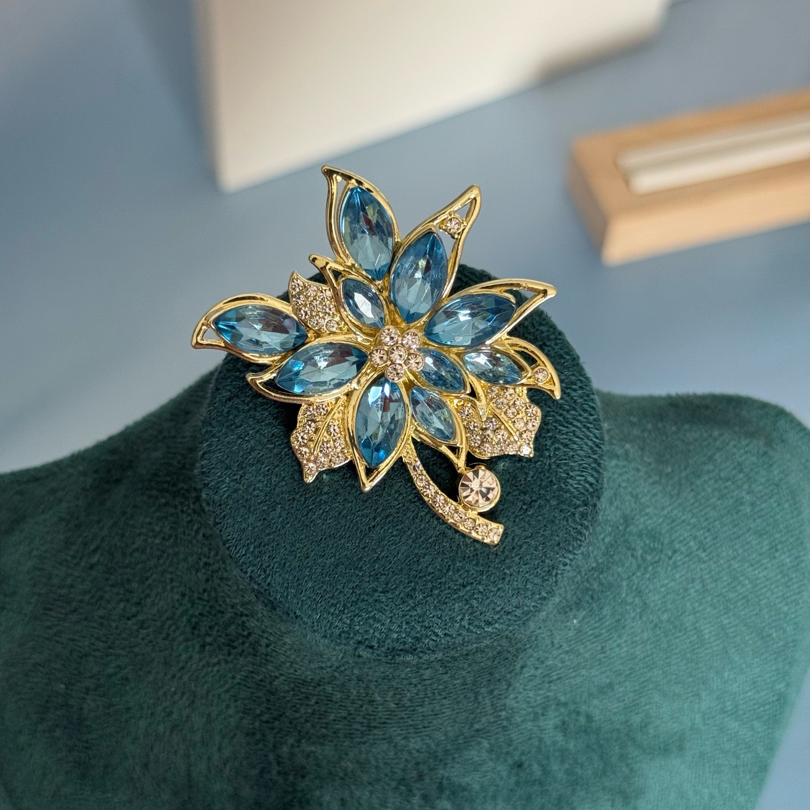 Blue flower brooch with rhinestones