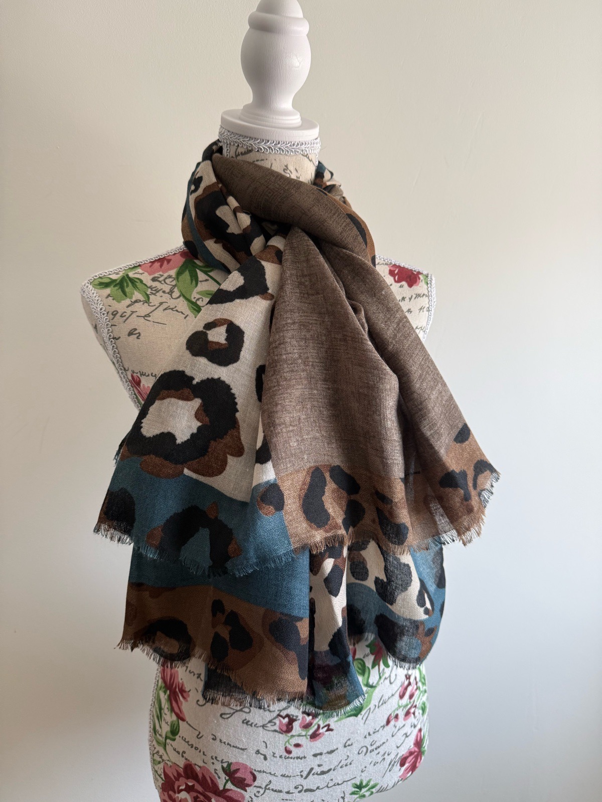 Leopard print scarf with blue accents
