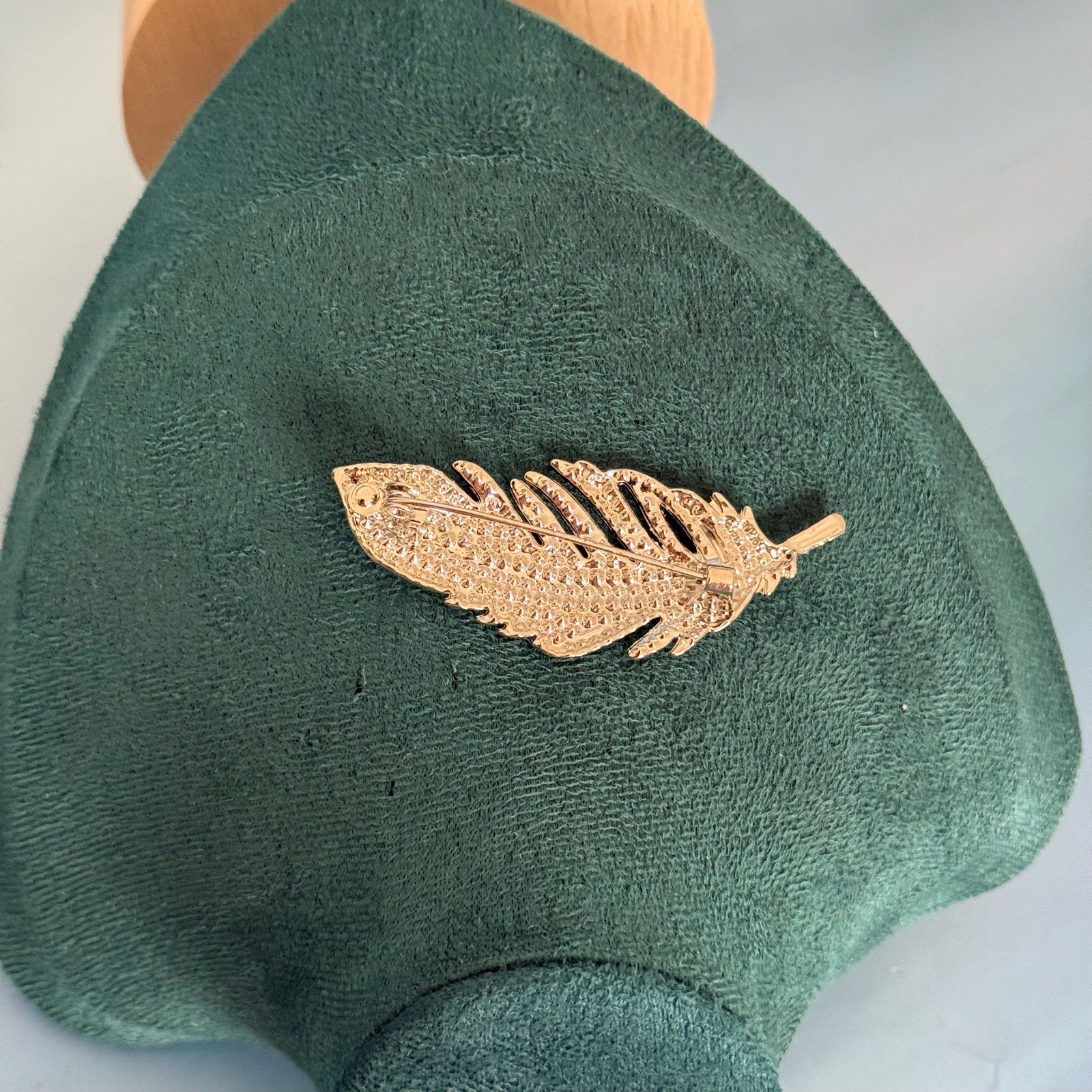 Silver rhinestone feather brooch