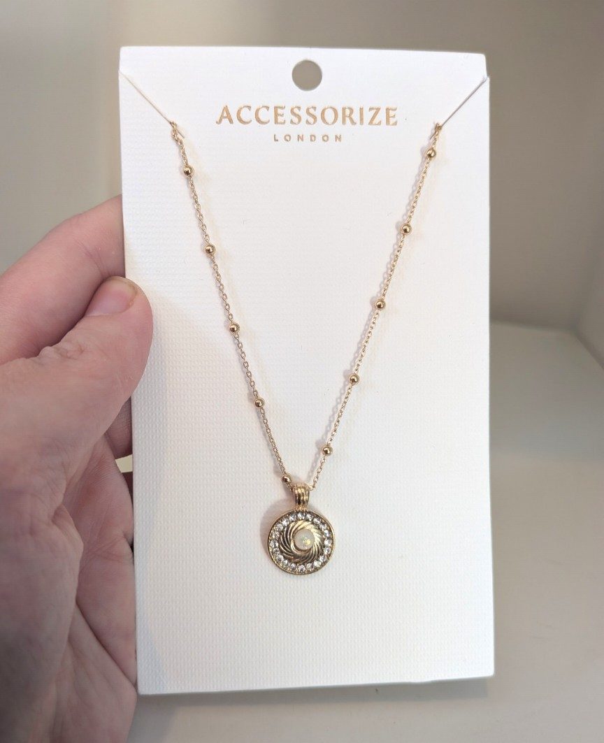 Brand new Accessories London necklace on its original display card.