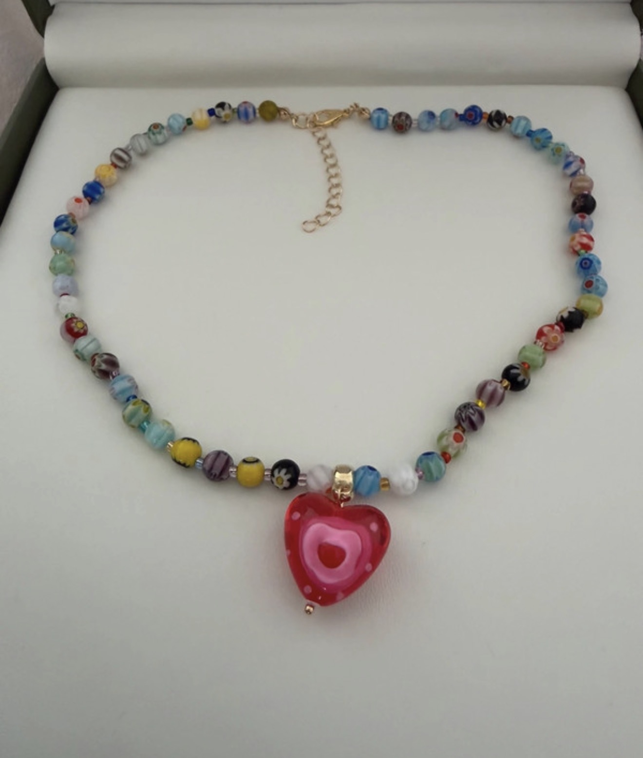 Gorgous beaded necklaceWith red heart detail