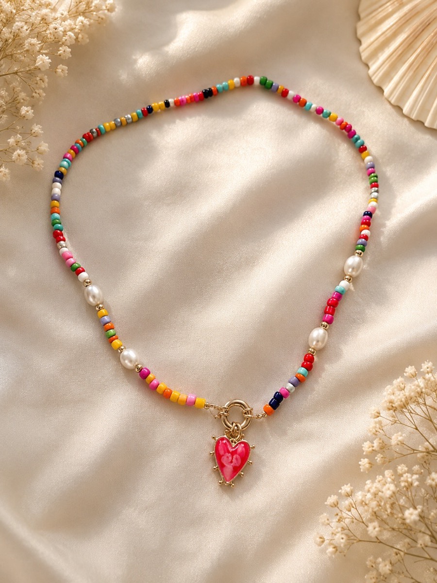 Stunning beaded necklace in vibrant colours and red heart centre piece