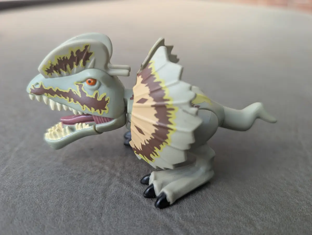 2015 Hasbro Jurassic World "Chompers" Dilophosaurus action figure.