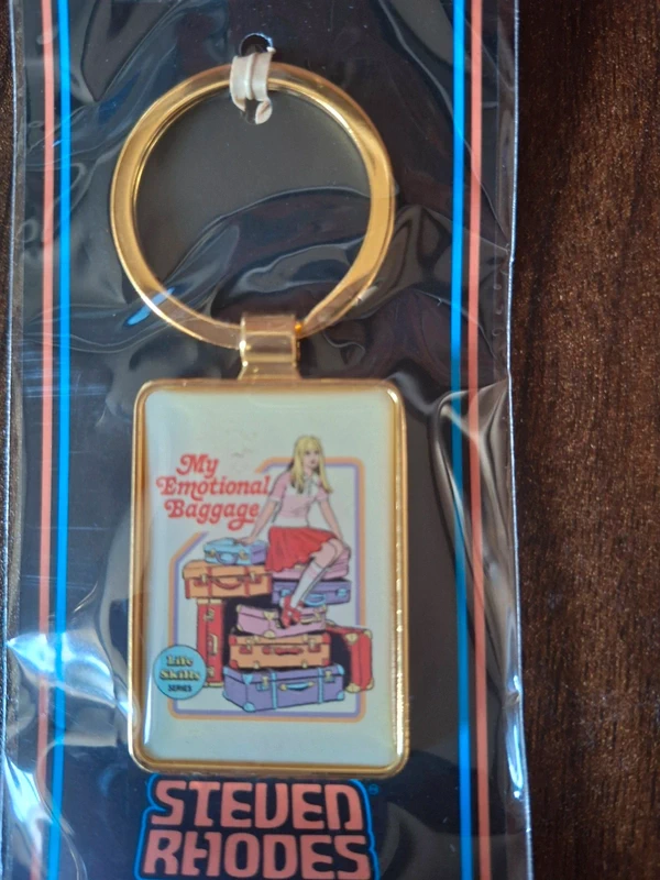 Steven Rhodes "My Emotional Baggage" Enamel Keyring – Retro Funny Gift Keychain