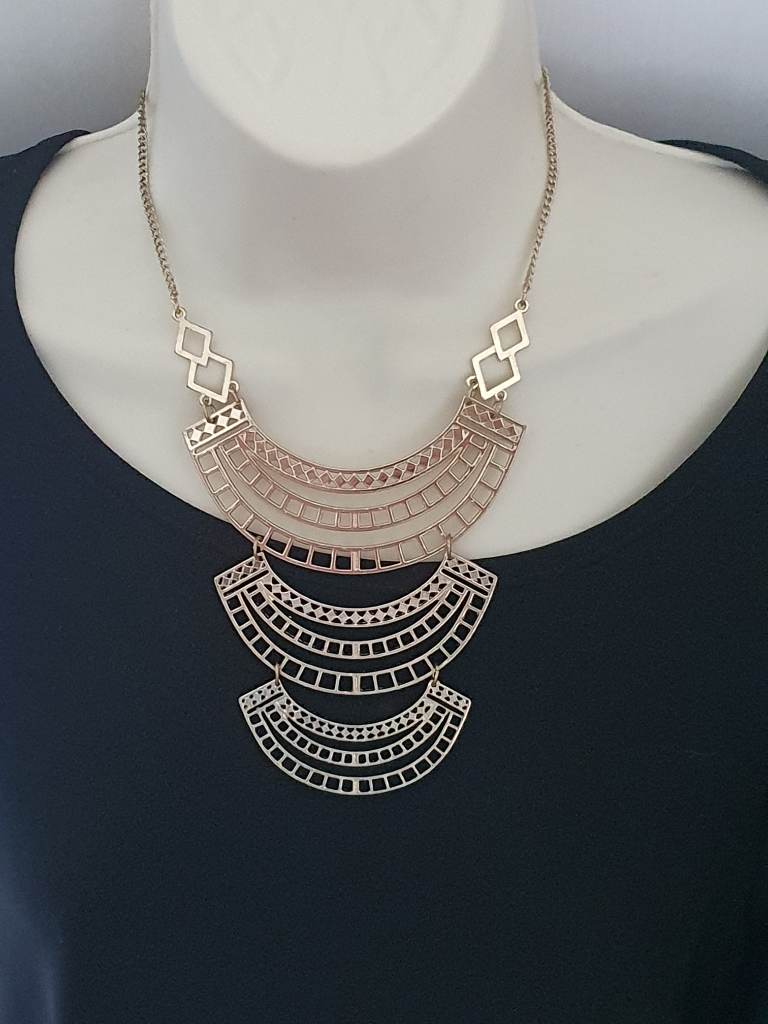 gold colour metal necklace