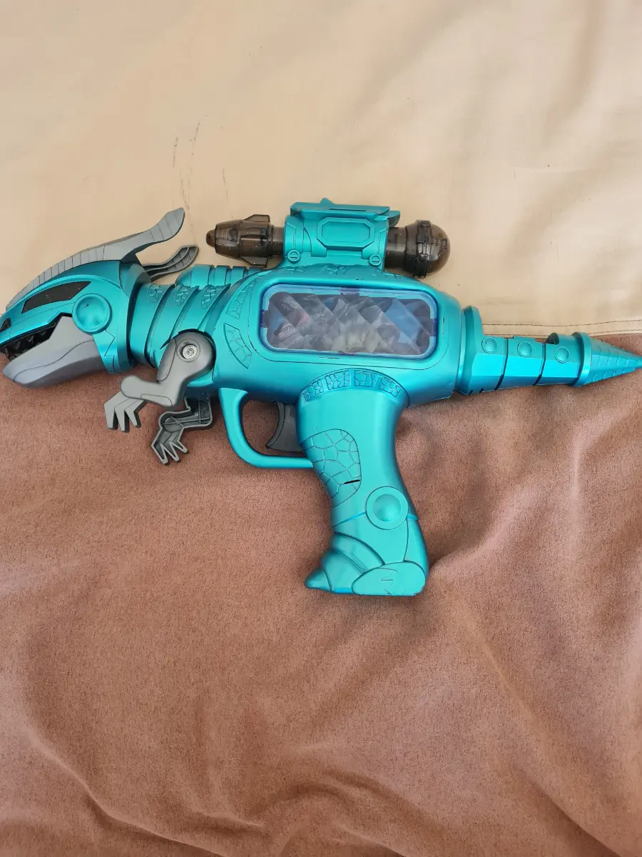 Toy dinosaur gun.