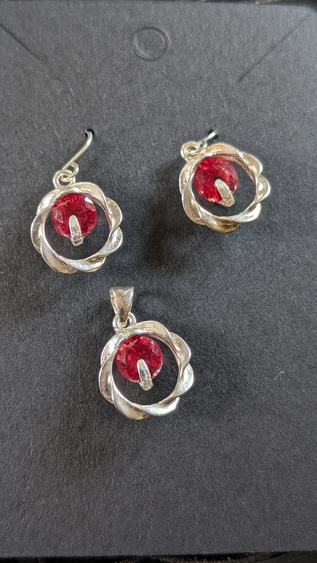 Lovely silver plated red crystal earrings and matching pendant set