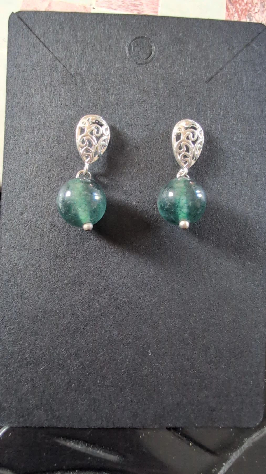 Silver plated filigree earrings with dark green acrylic dangling bead