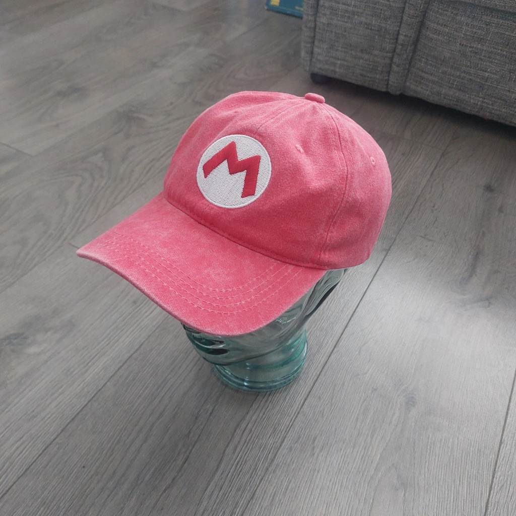 Red Plumber baseball cap.