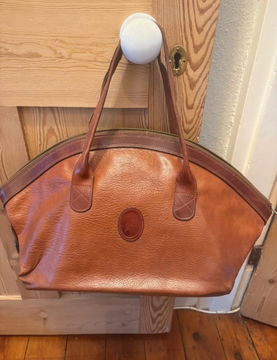 Vintage capacious and unusual brown leather handbag with dog motifs