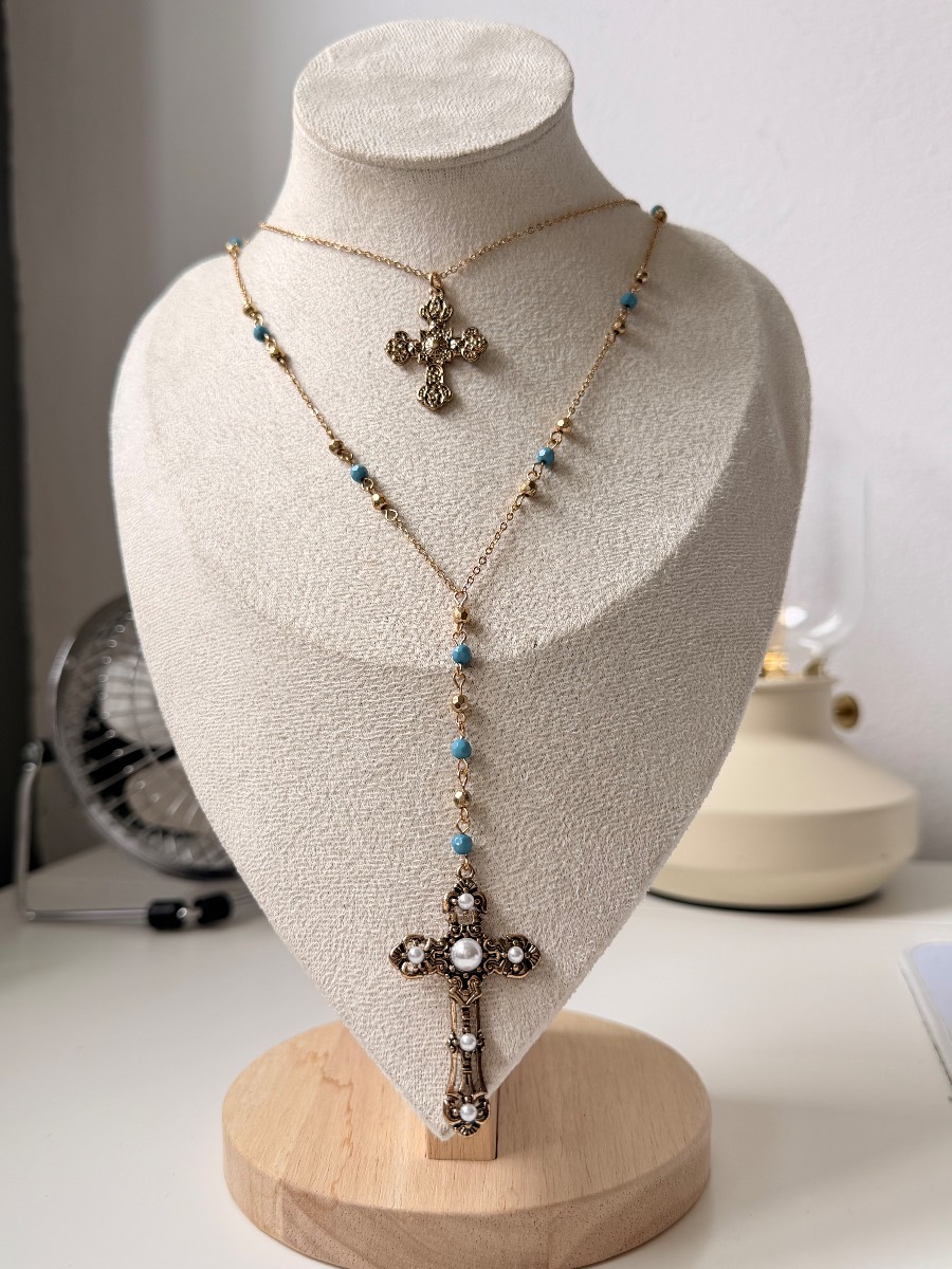 Gold tone layered y2k cross necklace with pearl and blue detailing