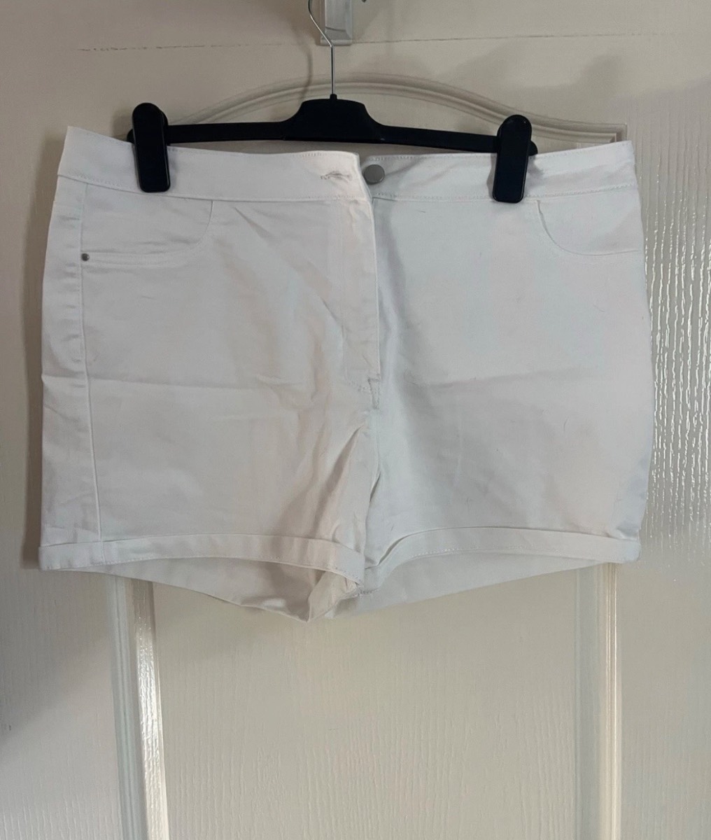 White denim shorts. Back pockets. Button & Zip Closure. Size 18