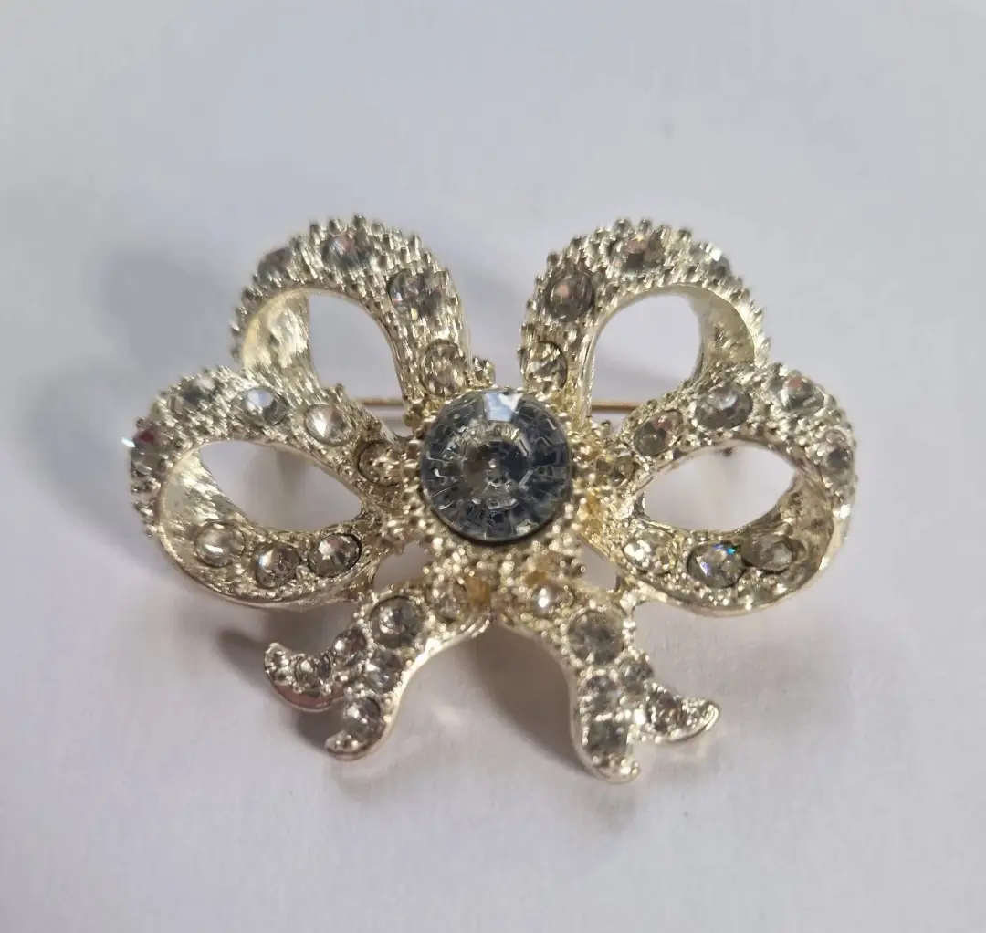Vintage Silver Tone Bow Brooch Clear Rhinestones Central Dark Stone