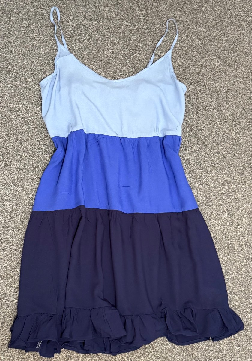 Blue tiered summer dress with adjustable straps. In a size 12-14.