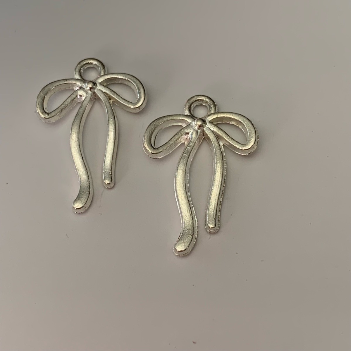 2 silver bow charms pendants