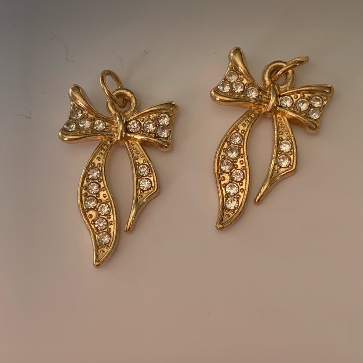2 gold bow charms pendants