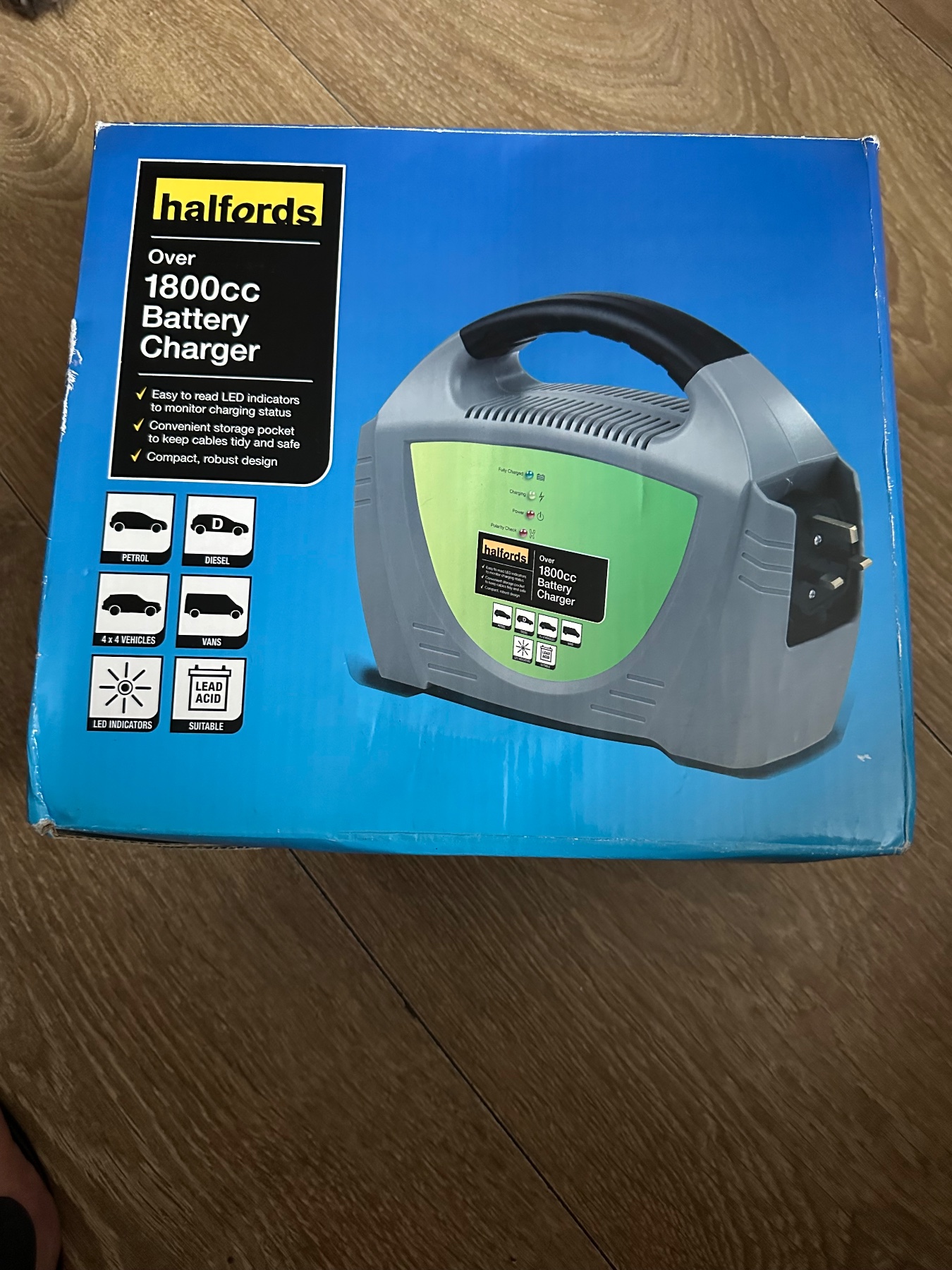 🔋 Halfords 1800cc+ Car Battery Charger box shows signs of wear from storage
