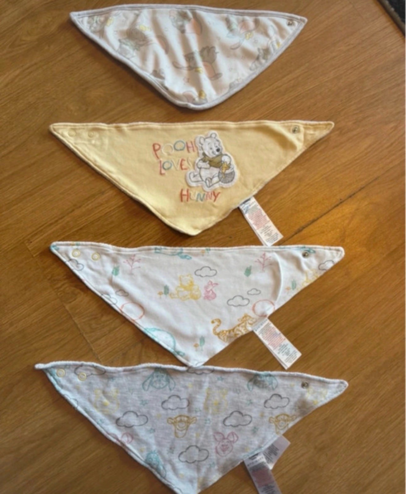 Used x4 Disney push button baby bibs