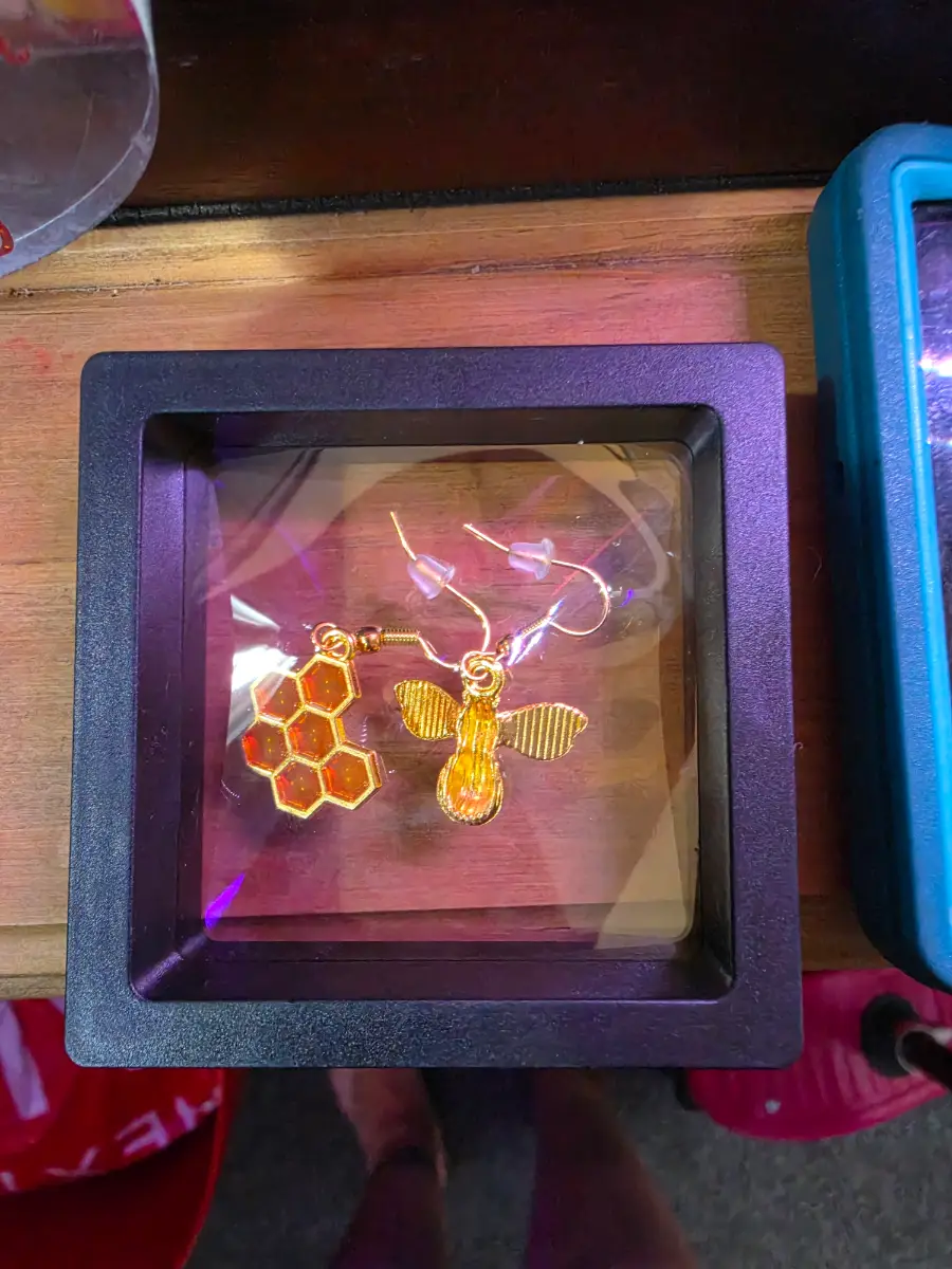 Bumblebee and honeycomb dangle earrings