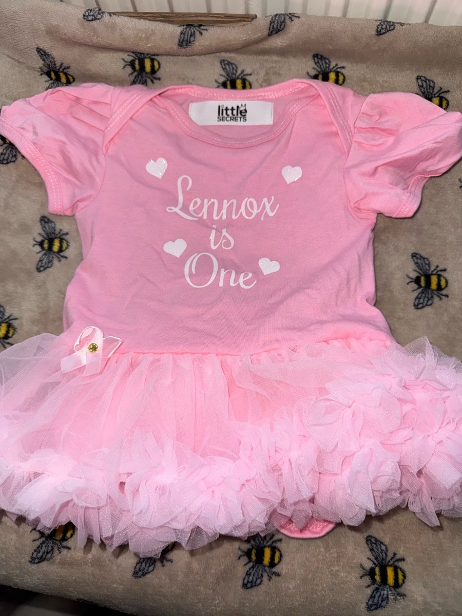 Little secrets baby girls pink tutu romper with "Lennox is one" print age 12-18 months
