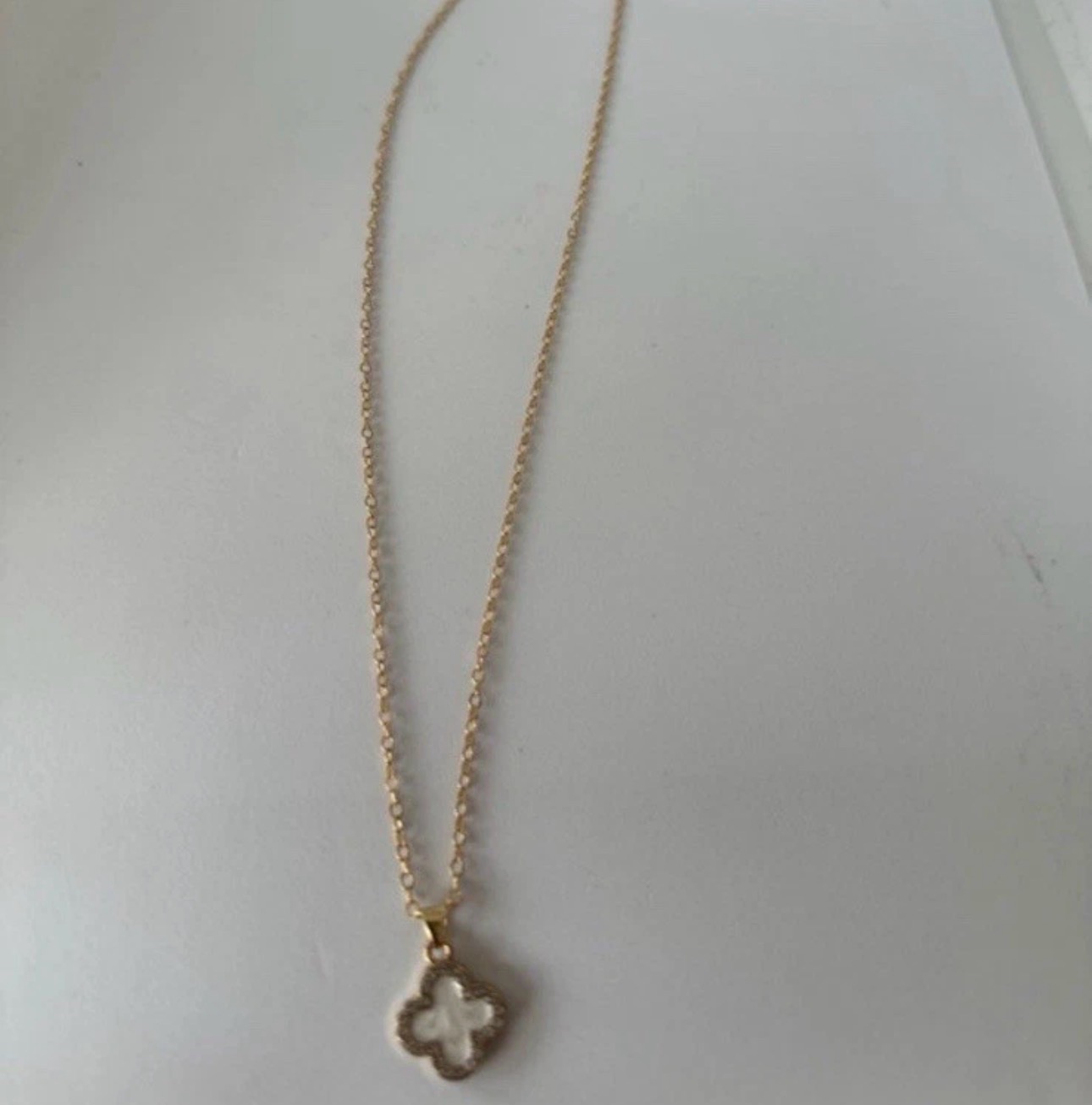 Gold tone clover necklace