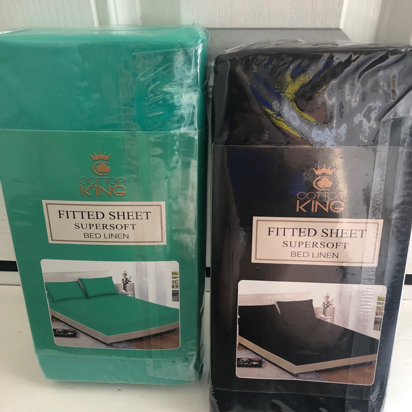 2 double fitted sheets in Polycotton  one emerald ,one black