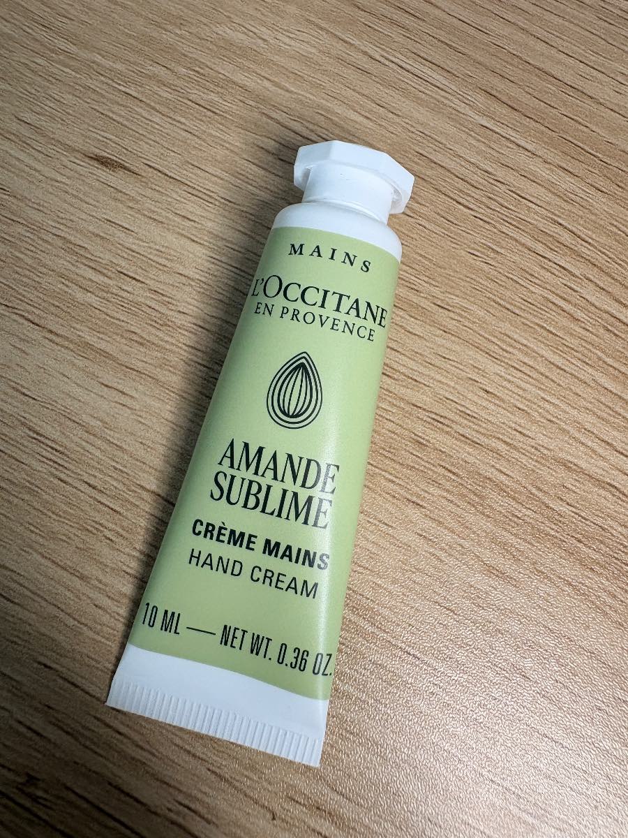 10ml tube of L'Occitane Almond Delicious Hands (Amande Sublime) cream.