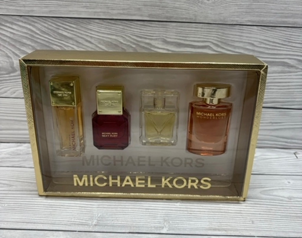 This Michael Kors mini perfume gift set includes four travel-sized Eau de Parfums in a gold box.