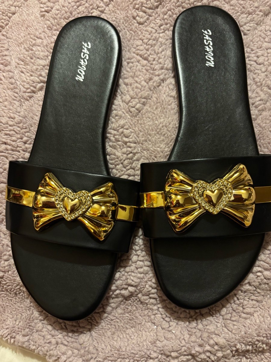 Ladies size 9 sandals with a gold bow design