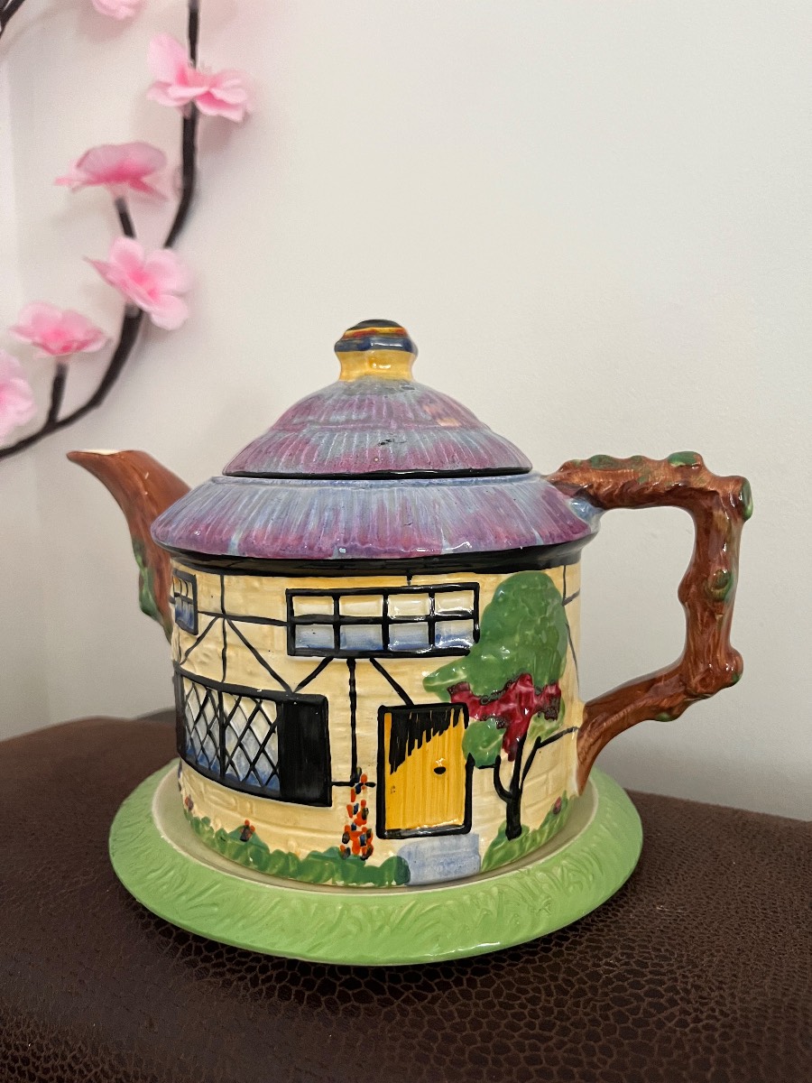 vintage cottage-shaped teapot, complete with its rare matching green stand/saucer,