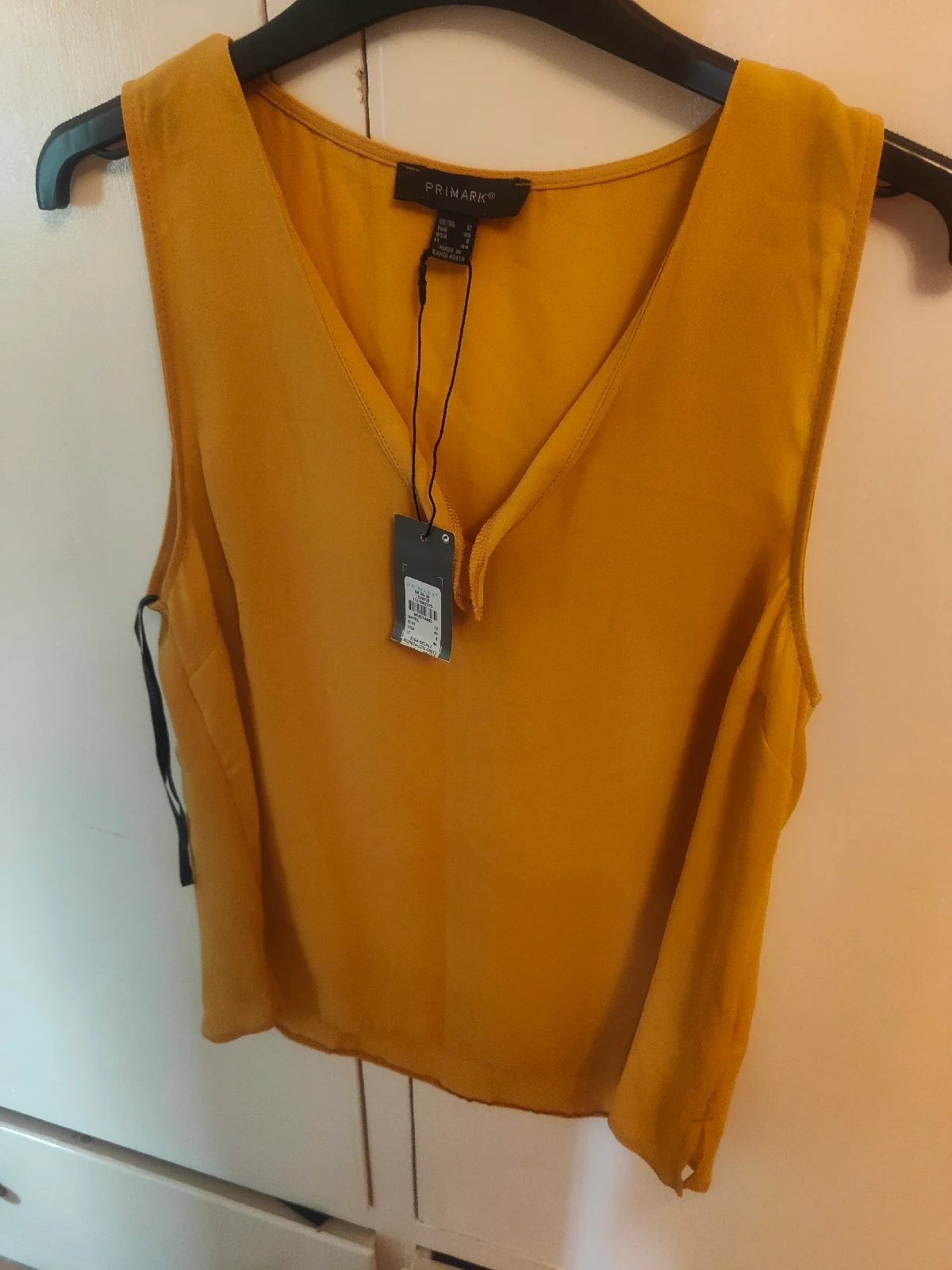 Mustard colour sleeveless blouse size 12
