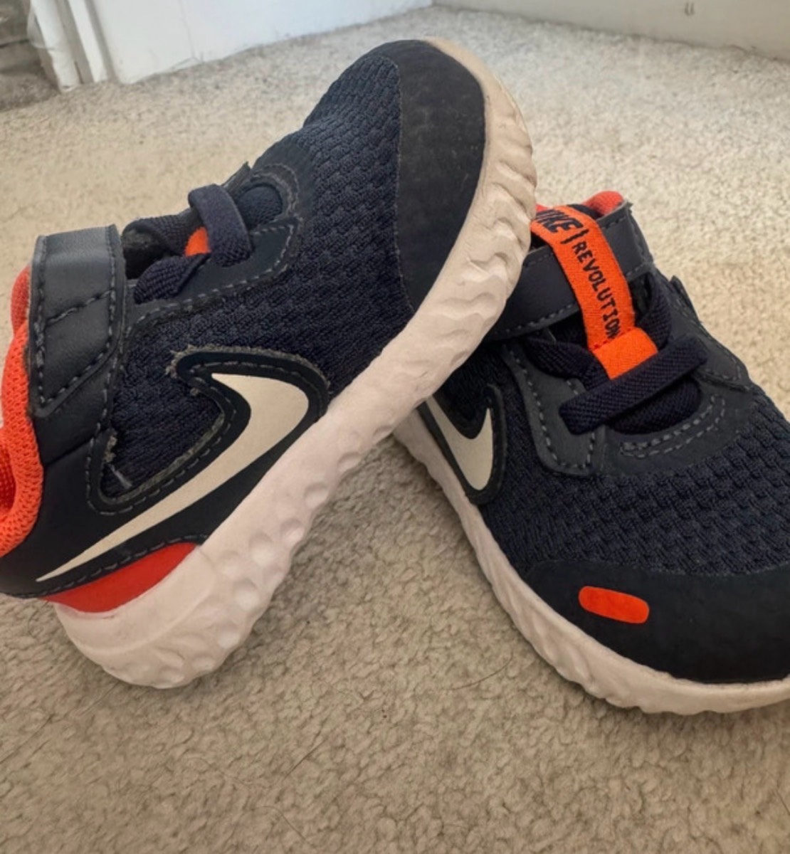 UK 3.5 baby Nike revolution trainers in navy blue and orange