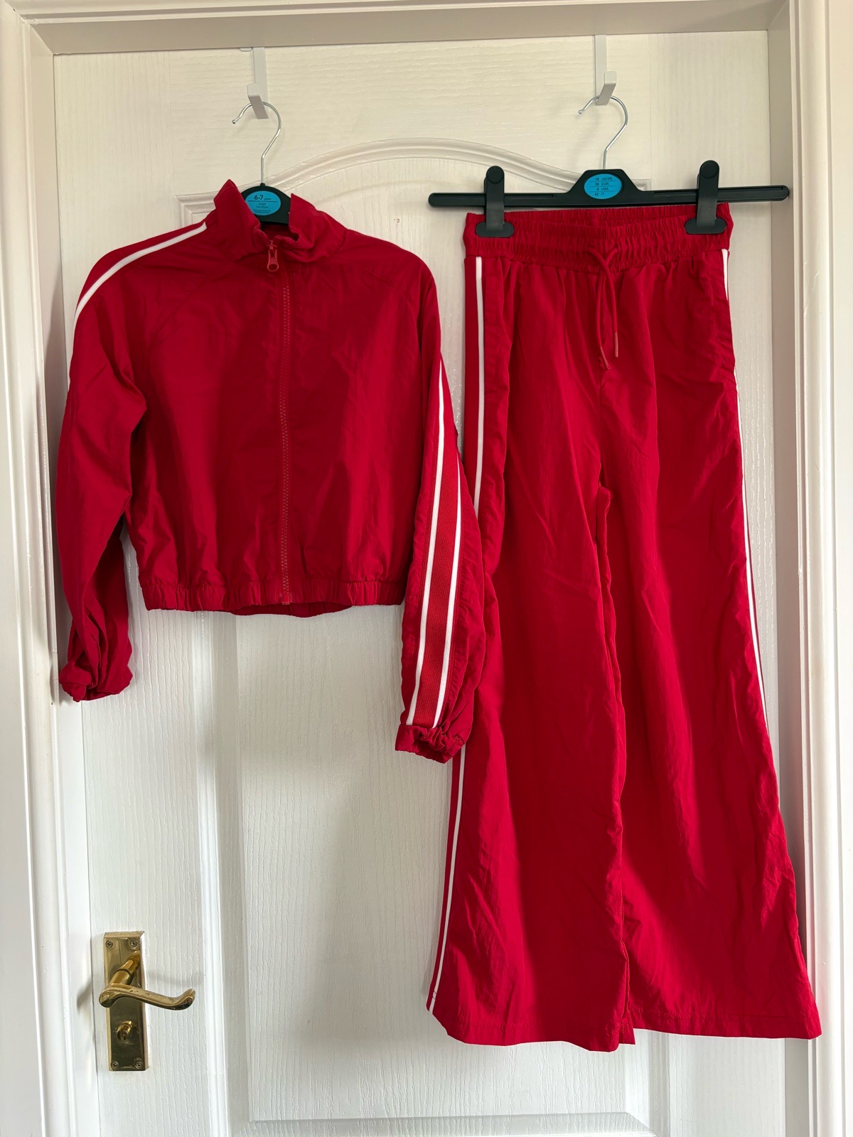 Girls red 2 piece tracksuit/outfit. 8-9 years