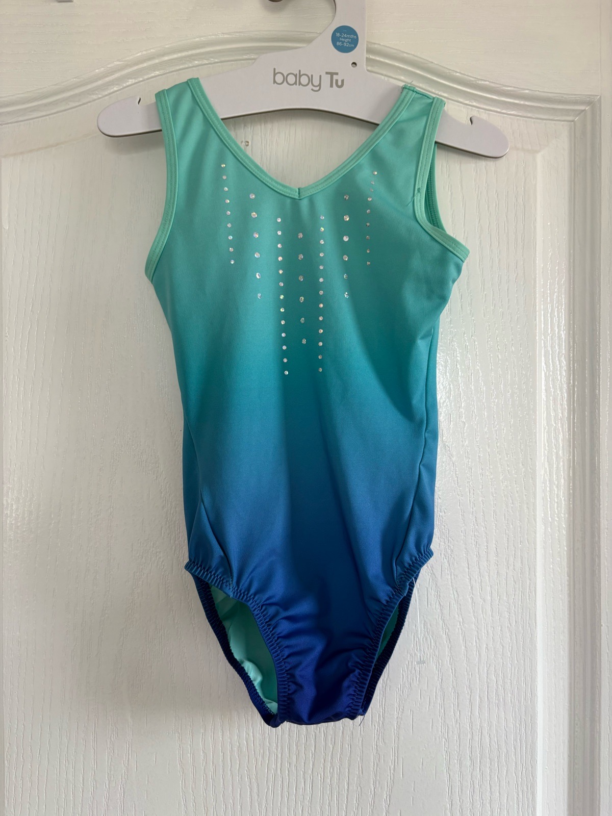 Turquoise sleeveless gymnastics leotard. Age 6