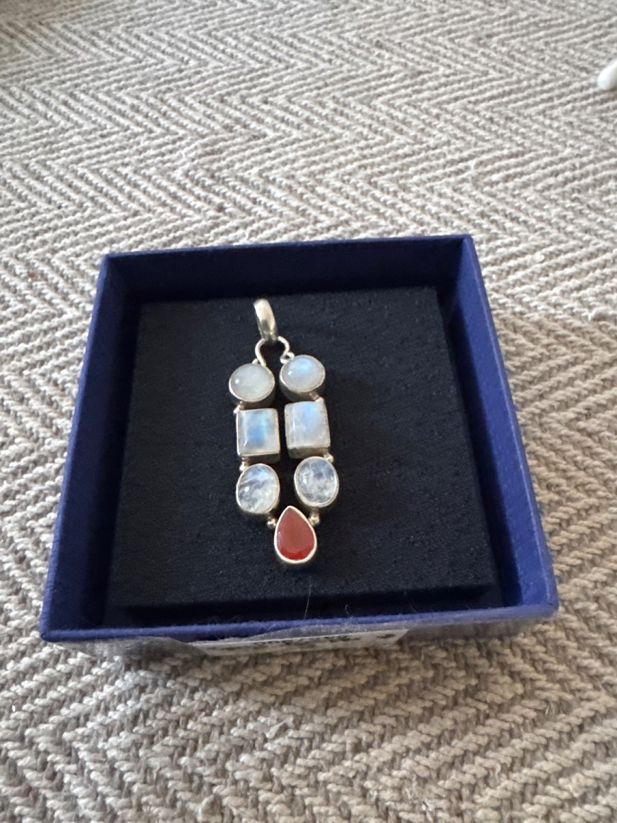 Moonstone and red gem silver pendant