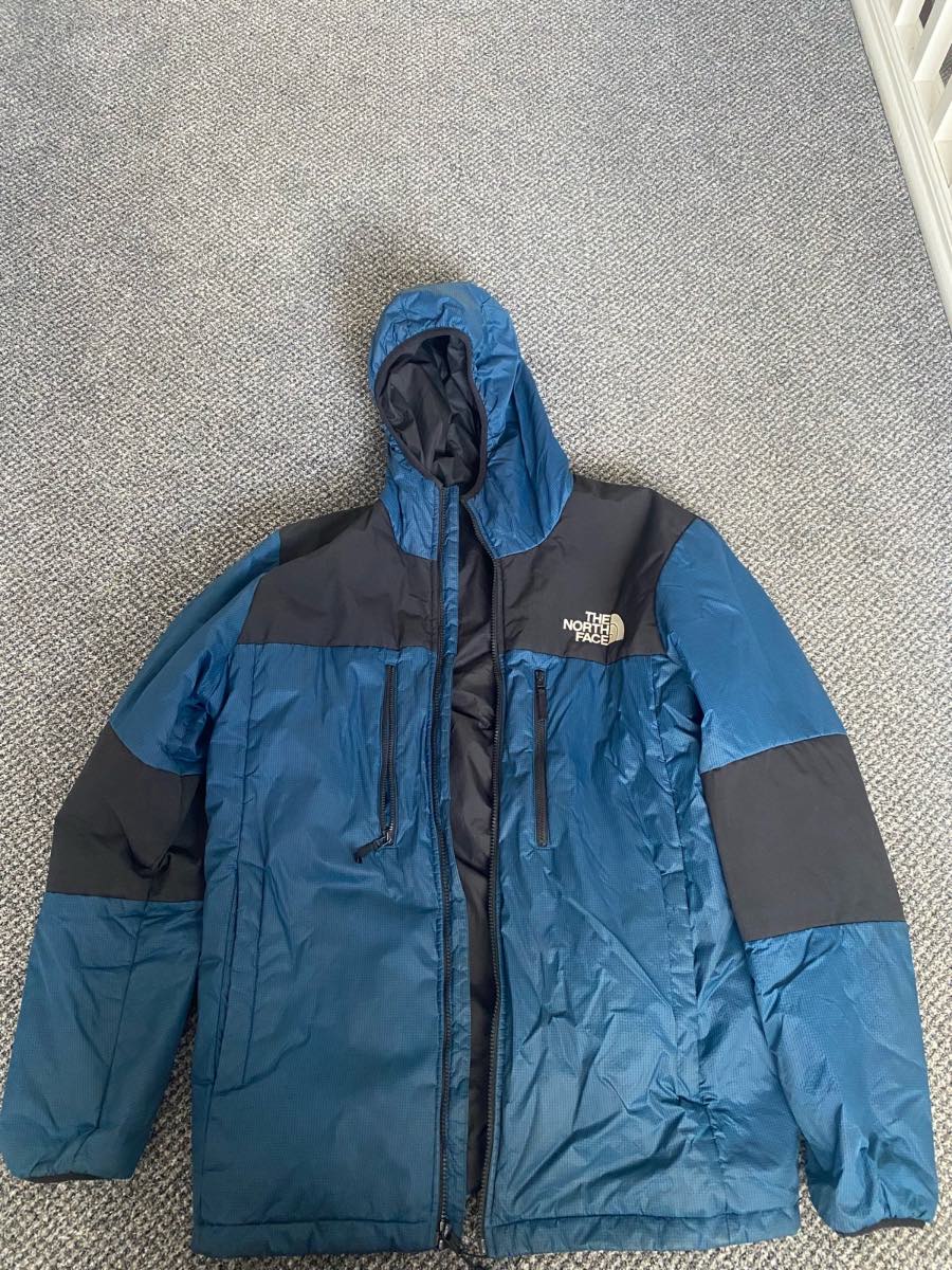 Blue and black north face puffer coat