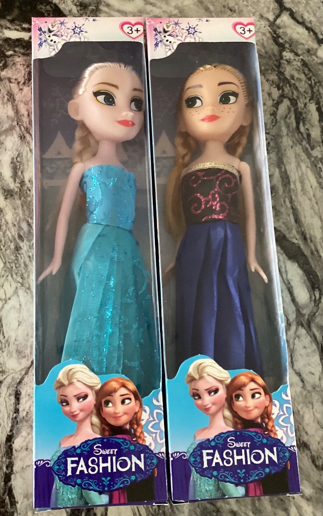 Two frozen dolls Anna & Elsa in boxes