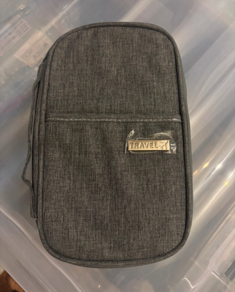 Passport holder grey in colour