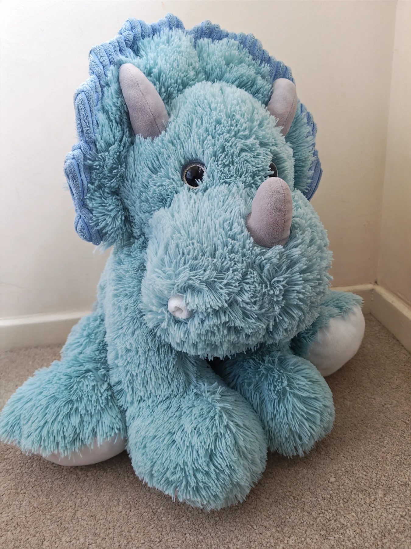 Large blue triceratops cuddly toy