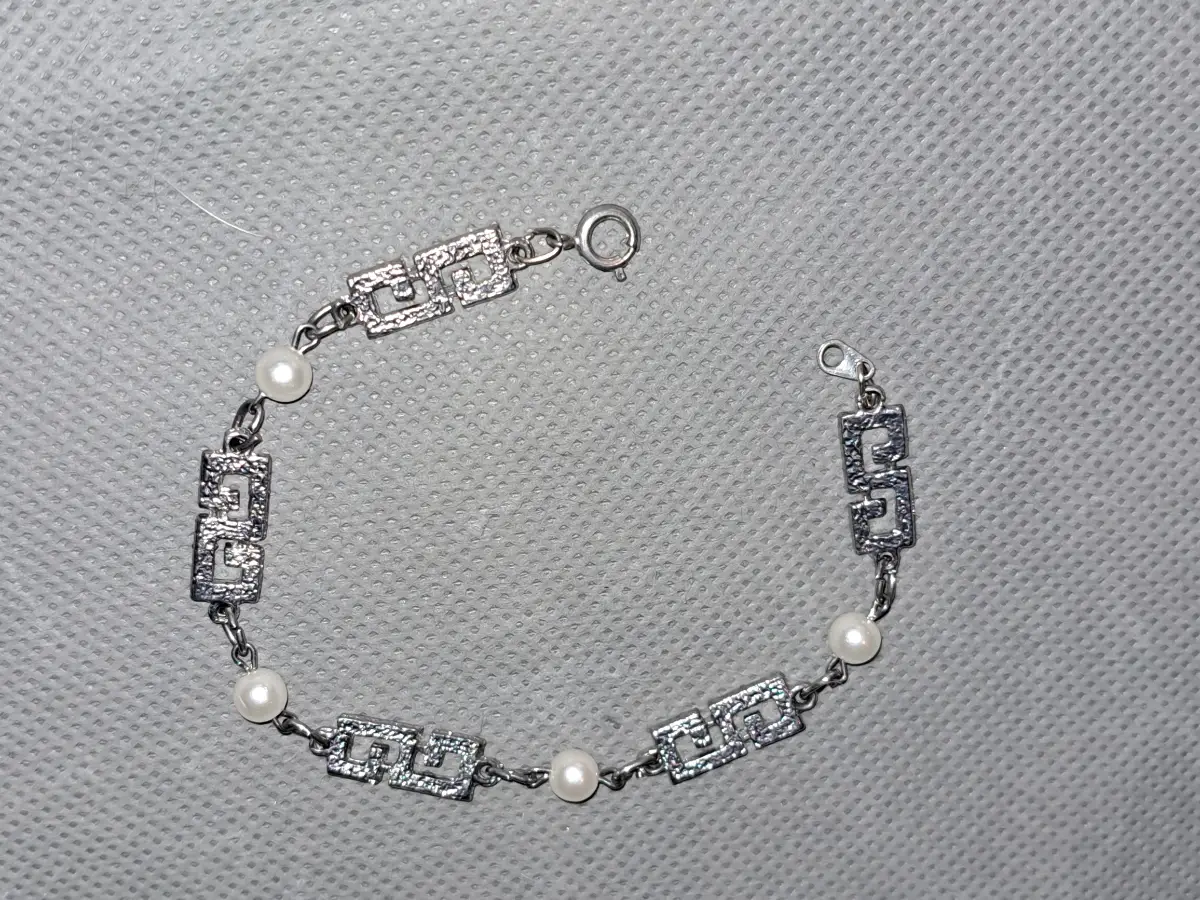 silver tone and pearl bracelet